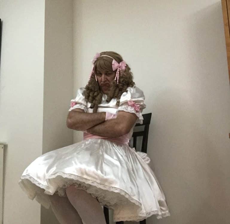 A Slave Guy the man was dressed as a sissy adult.