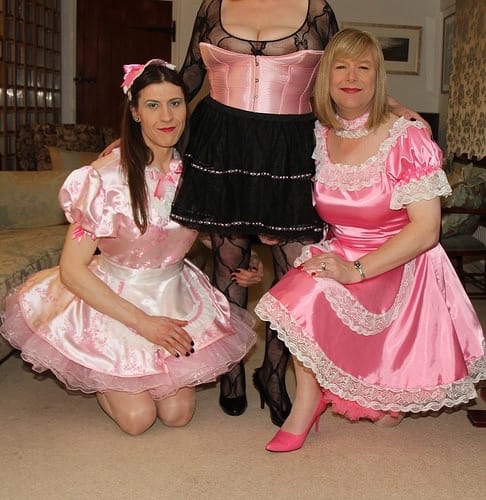 Pink and black gowns are worn by three hot sexy girls.