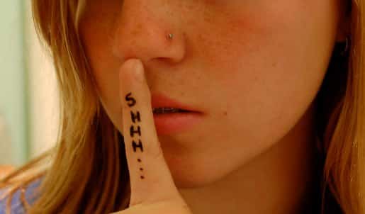 A Nosepin Sexy Girl is tattoed with the word "Shhh.... "